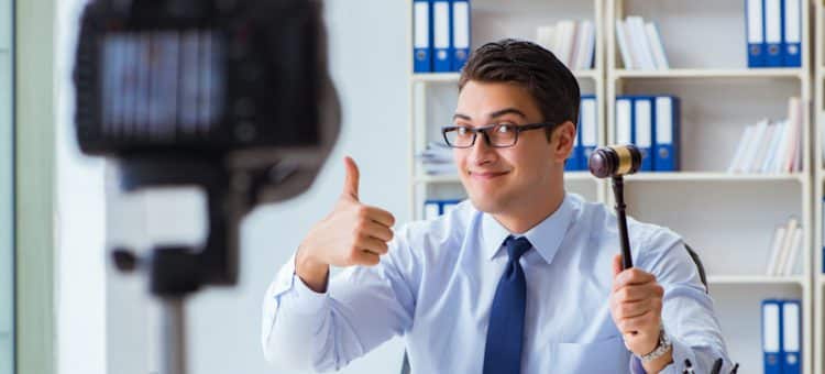 lawyer thumbs up holding gavel