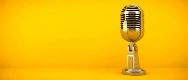 golden microphone for podcast on yellow background