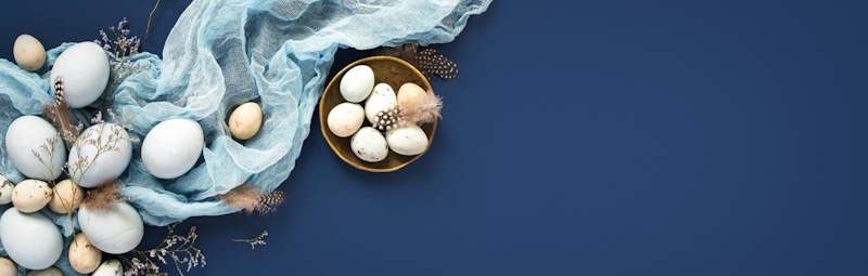 easter eggs golden white and silver in blue background